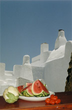 White aubergine, watermelon, small tomatoes and a house in Pyrgos, june 2002.